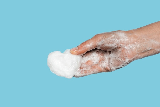 Free Photo person washing hands with a white soap