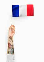 Free photo person waving the flag of french republic