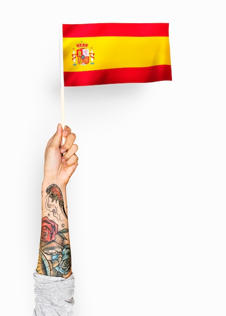 Person waving the flag of Kingdom of Spain