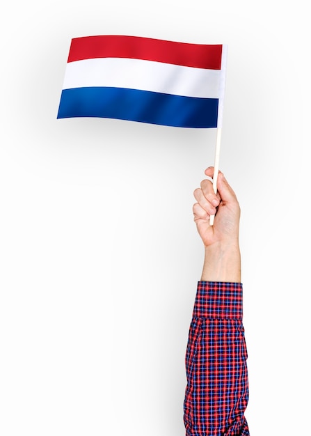 Person waving the flag of The Netherlands