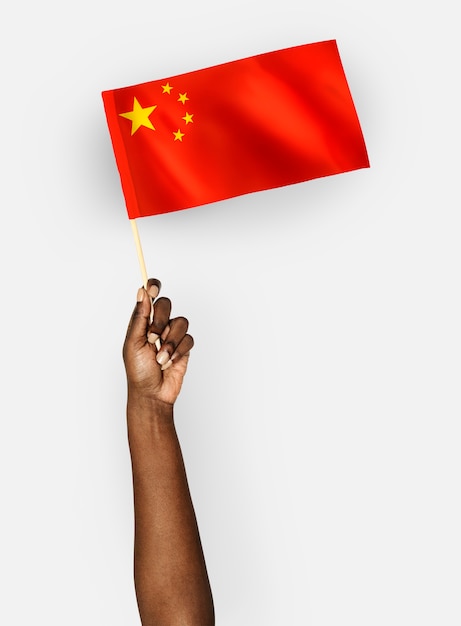 Person waving the flag of the People's Republic of China