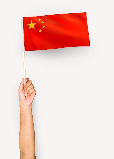 Person waving the flag of the People's Republic of China