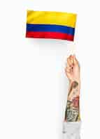 Free photo person waving the flag of republic of colombia