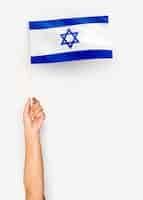 Free photo person waving the flag of state of israel