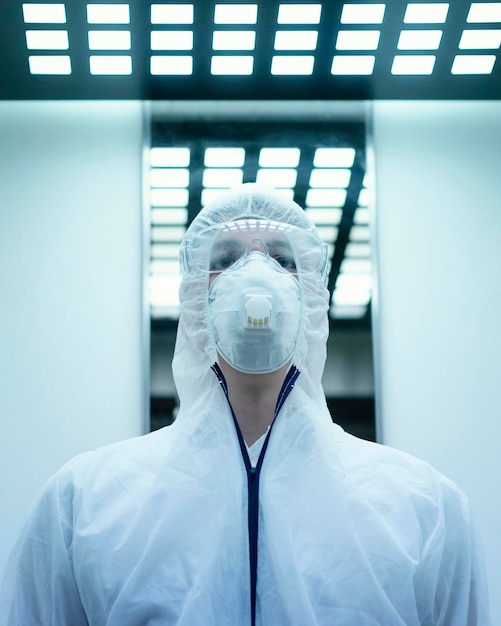 Free Photo person wearing a prevention suit against a bio-hazard