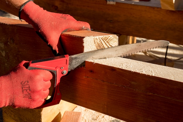 Free photo person wearing protection gloves and using a drill