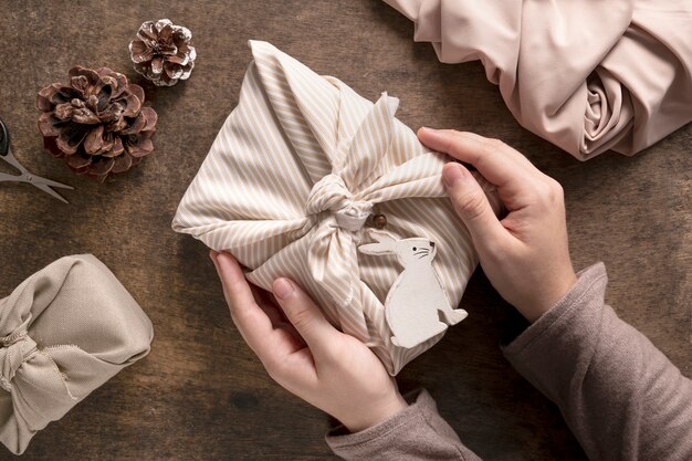 Person with festive wrapped christmas gift