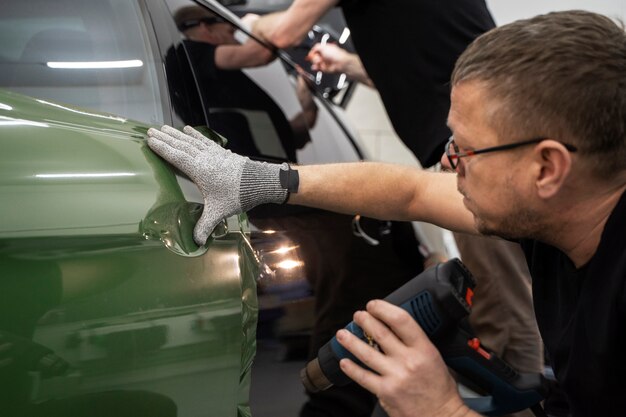 Person working on car wrapping