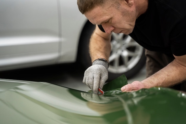 Person working on car wrapping