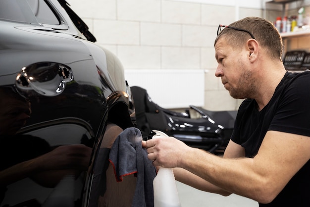 Free Photo person working on car wrapping