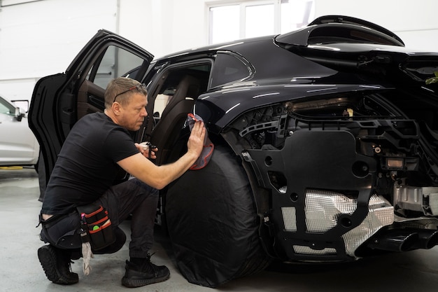 Person working on car wrapping