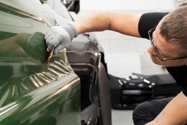 Free Photo person working on car wrapping