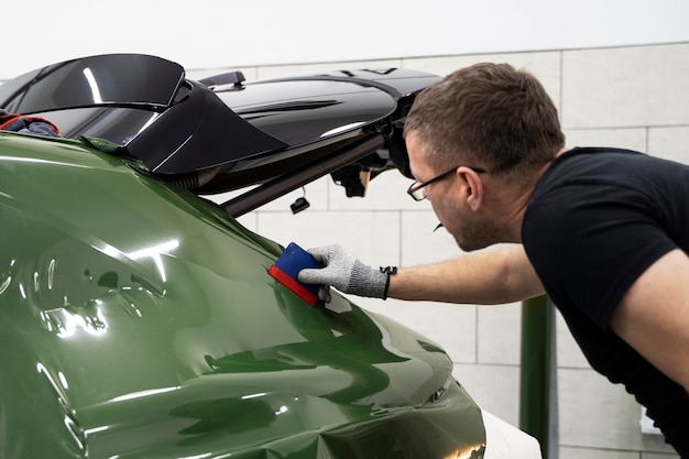 Person working on car wrapping