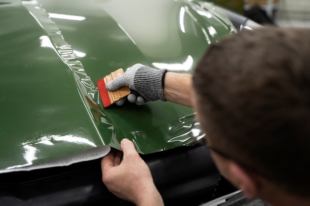 Person working on car wrapping