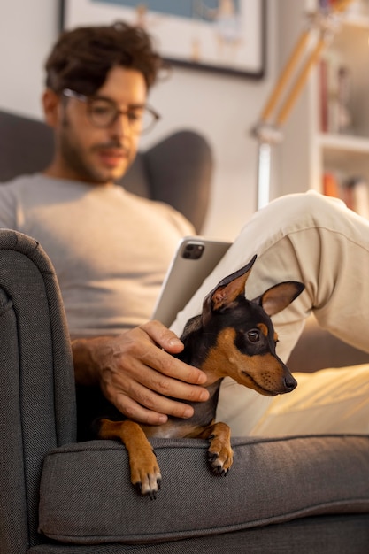 Free Photo person working from home with pet dog