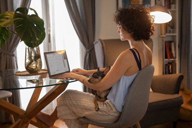 Free photo person working from home with pet dog