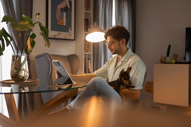 Free photo person working from home with pet dog