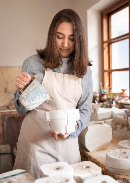 Person working in a pottery workshop