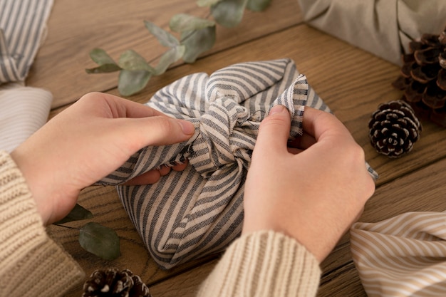 Person wrapping a christmas gift