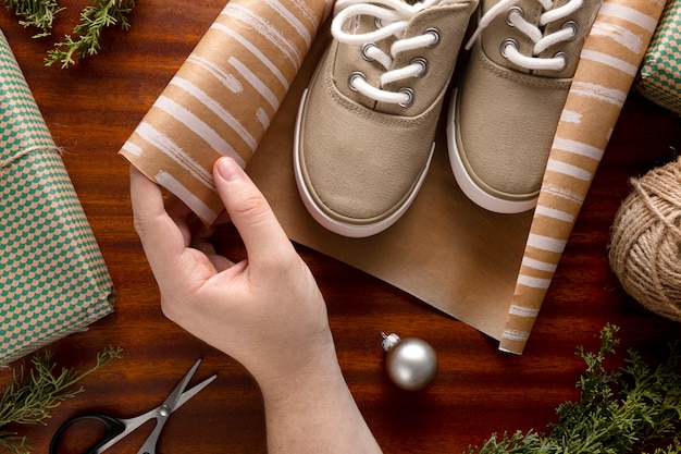 Person wrapping a christmas gift