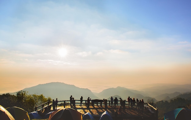 Perspective beautiful moutain view with crowded silhouette people at doi ang khang  chaing mai thailand