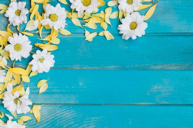 Free photo petals and white flowers on table