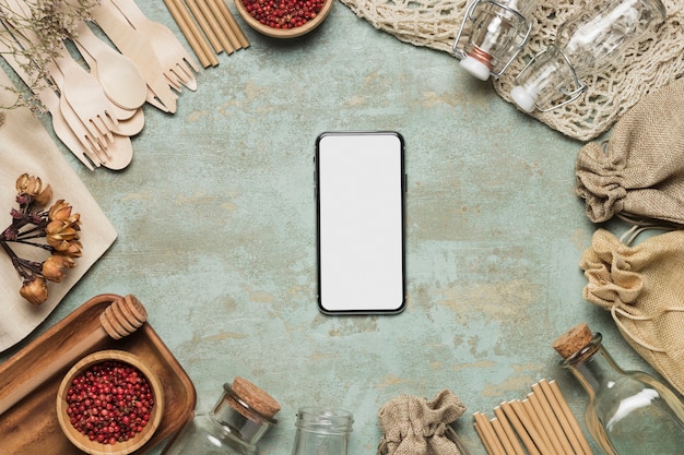 Free photo phone mock-up with environment friendly objects