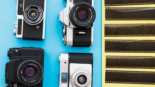 Free photo photo cameras near pieces of film