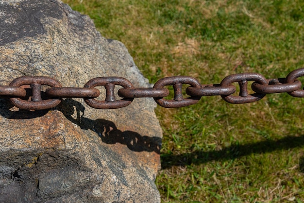 Photo of chain on stone