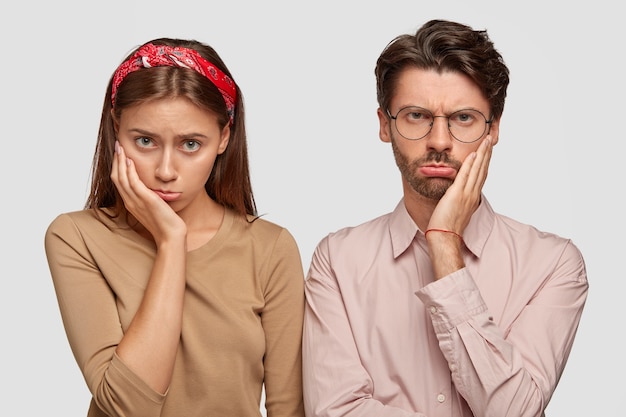 Free Photo photo of displeased woman and man have sullen expressions