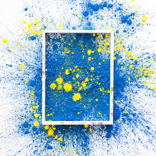 Free photo photo frame on blue and yellow bright dry colors