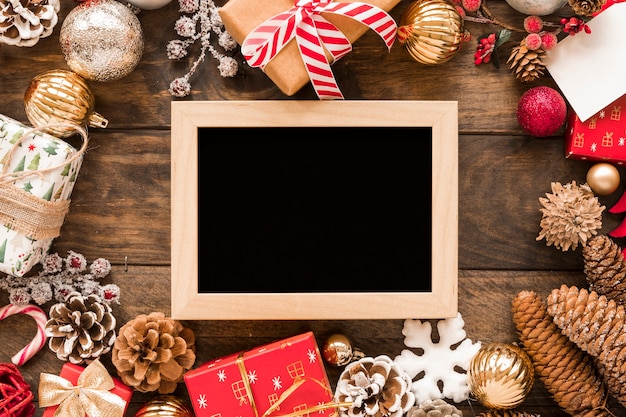 Photo frame between Christmas decorations