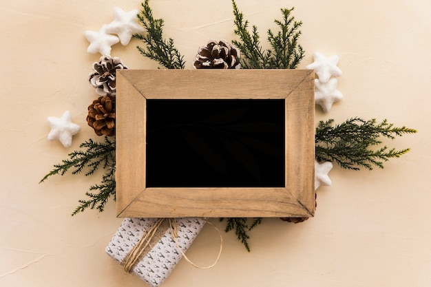 Free Photo photo frame on composition of snags and coniferous twigs 