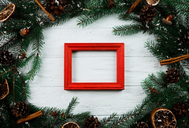 Free photo photo frame between fir branches