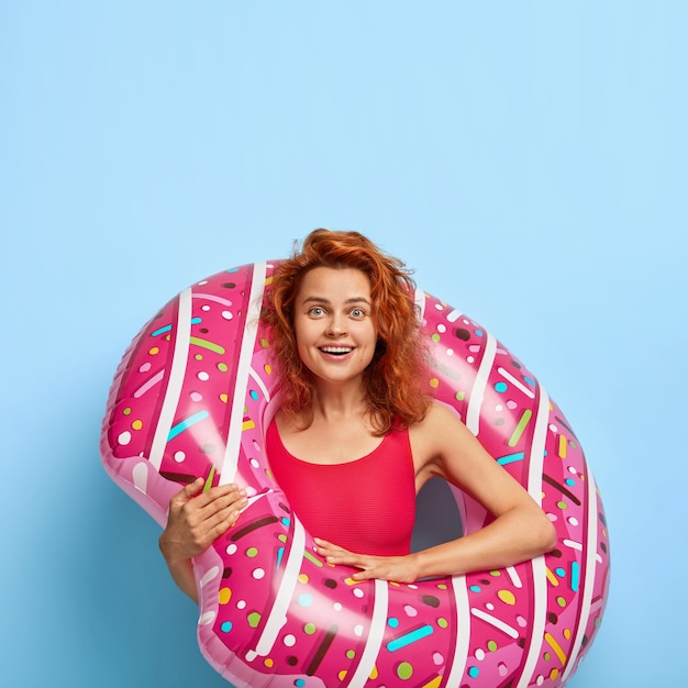 Free Photo photo of happy redhaired woman dressed in bikini