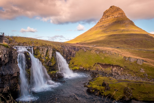 Photo of Kirkjufell volcano and its waterfall during the morning, in the East of Iceland.