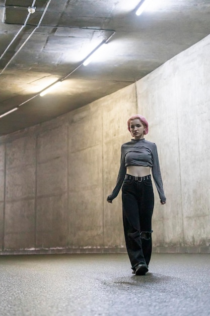 Free Photo photo of young lady walking at the tunnel