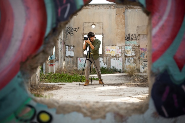 Free photo photographer exploring abandoned location