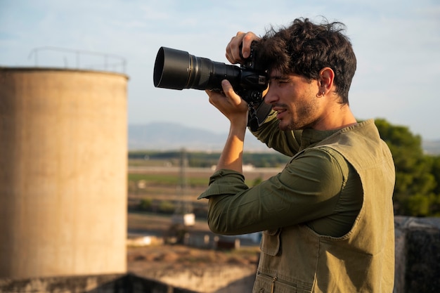 Free photo photographer exploring abandoned location