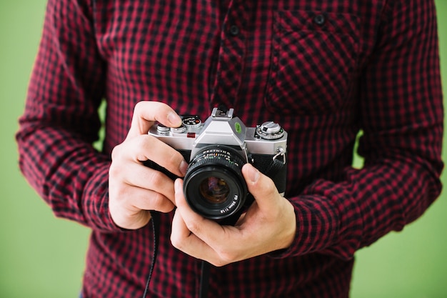 Free Photo photographer holding camera