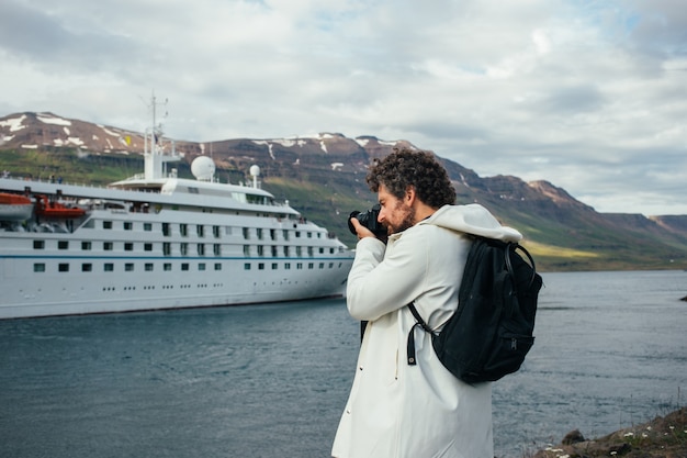 Free Photo photographer make photos of cruise ship in fjord