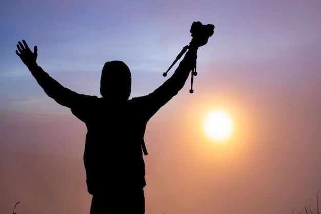 Free Photo a photographer photographs the dawn of the sun on the volcano batur. bali indonesia