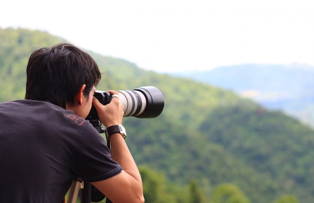 Photographer taking a photo outdoors