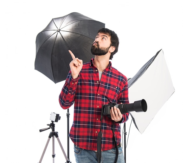 Free photo photographer thinking over white background