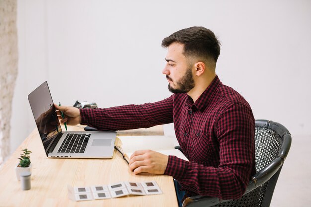 Photographer using laptop