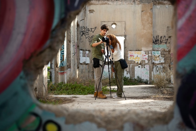 Free Photo photographers exploring abandoned location