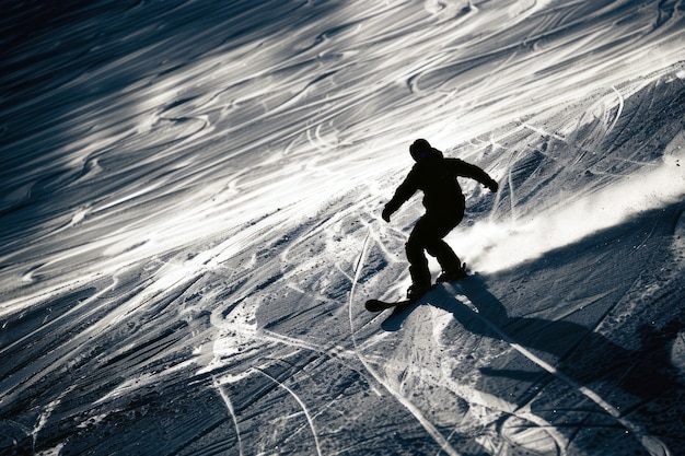 Free photo photorealistic wintertime scene with people snowboarding