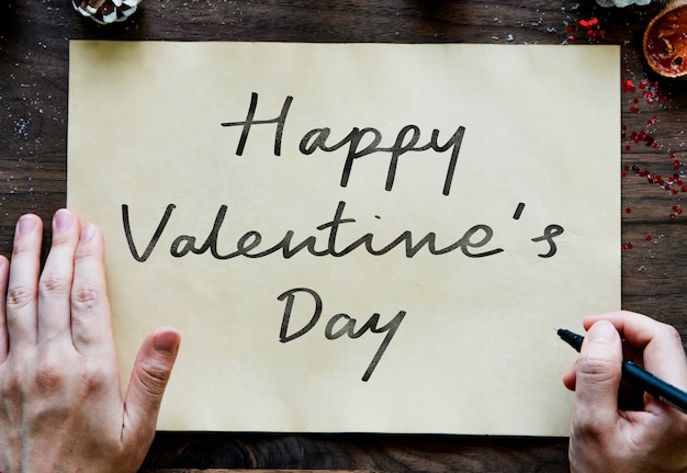 Free photo phrase happy valentine's day on a paper