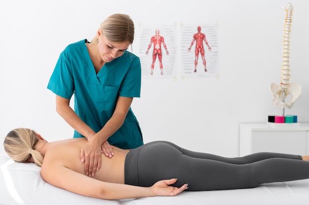 Physiotherapist giving a massage to her patient