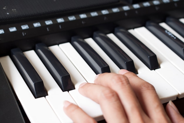 Piano keyboard with woman